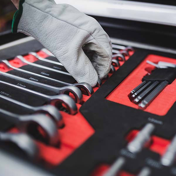 Set of the professional tools. Closeup of chrome wrench tools organized in box.