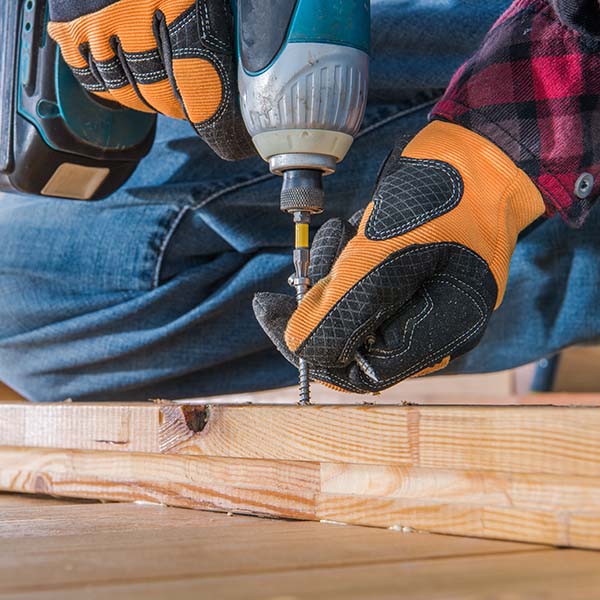 Carpenter Using Drill Driver In Woodworking.