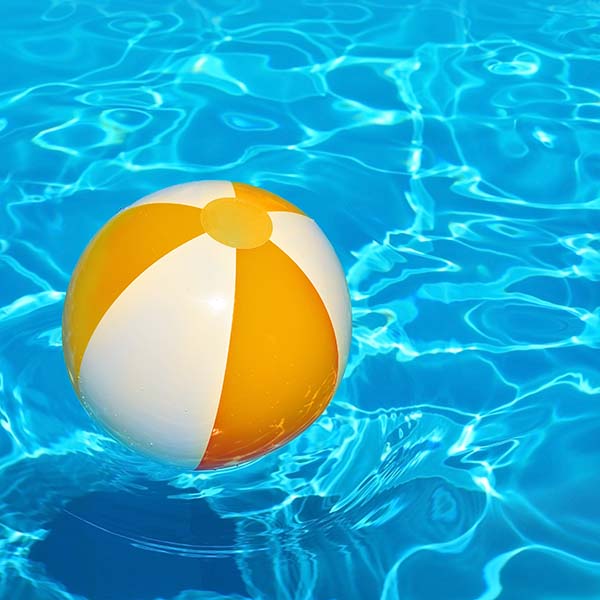 Ball in swimming pool water